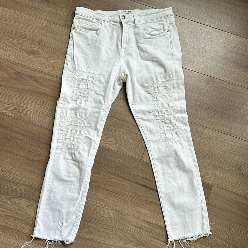 FRAME denim jeans. White with distressing that does not show skin. Size 29